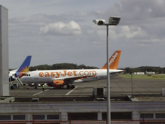 Airbus A319 (G-EZBK) - Pushing back from gate as flight EZY6473 to Jersey - 09/08/2014