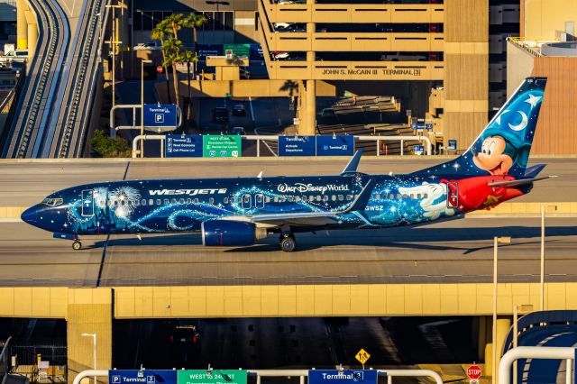 Boeing 737-800 (C-GWSZ) - WestJet 737-800 in Sorcerer Mickey special livery taxiing at PHX on 11/13/22. Taken on a Canon R7 and Tamron 70-200 G2 lens.
