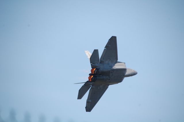 Lockheed F-22 Raptor (F22) - F-22 AF Demo team doing a low-radius turn after a practice approach at KTVC. 