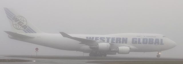 Boeing 747-400 (N356KD) - Maintenance Building parking lot taxiway, foggy morning, Anchorage International Airport