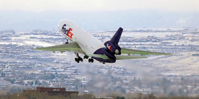 McDonnell Douglas DC-10 (N313FE) - Flashback to Jan, 2017 ~~br /Fed Ex's "Bilal" climbing thru a light snowfall as it departs for Memphis.