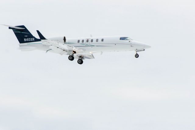 Learjet 40 (N40XR) - 11Jan2014 runway 26 tech stop.