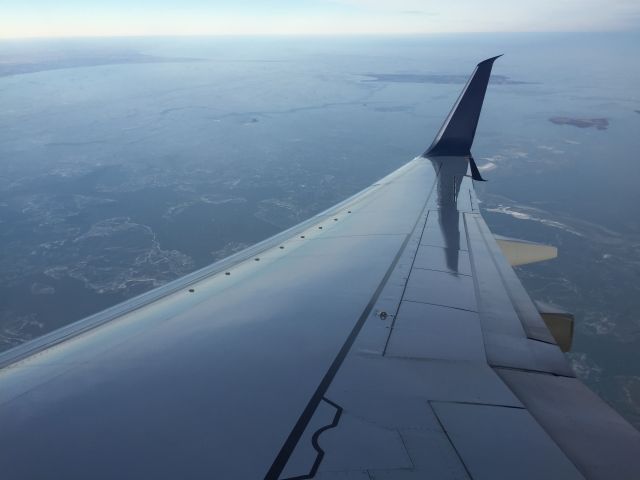 Boeing 737-900 (N849DN) - Flying over Lake Erie, inbound for Detroit from Orlando