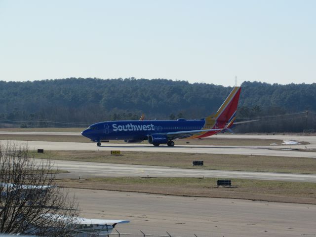 Boeing 737-800 (N8662F) - Southwest flight 3801 from Chicago Midway Intl, a Boeing 737-800 taxiing to the gate about to cross to the other side of the airport after landing on runway 23R. This was taken January 30, 2016 at 3:47 PM.