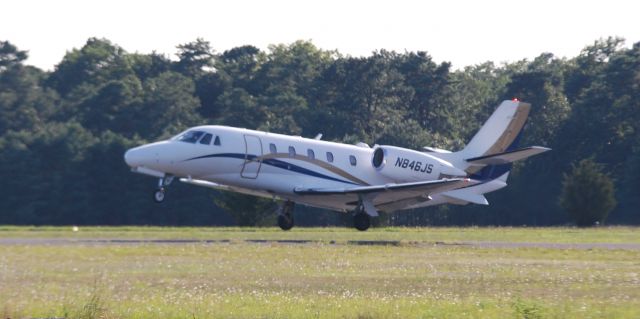 Cessna Citation Excel/XLS (N846JS) - A Cessna Citation takes off from Monmouth Jet Center, NJ