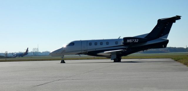 Embraer Phenom 300 (N6232) - Catching some tarmac time is this 2014 Embraer 505 Phenom 300 in  the Autumn of 2023.