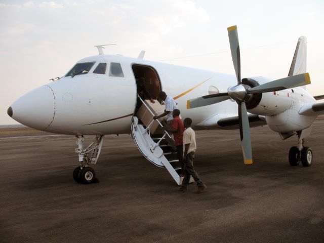 Grumman Gulfstream 1 (ZS-OOE) - Loading ballot papers at Quelimane, Mozambique.