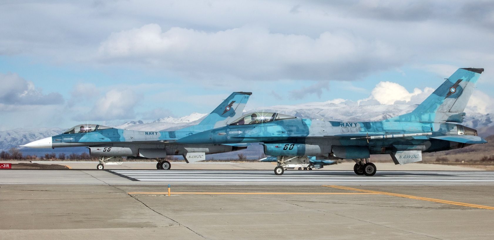 Lockheed F-16 Fighting Falcon (92-0409) - A pair of NAWDC Vipers (900947 .. "Side Five Six" and 920409 .. "Side Six Oh") are all lined up and prepared to light em up and go from NAS Fallons runway 31L.br /To my tremendous surprise, this is the first snap of 92-0409 to be posted into FAs photo gallery.br /My very sincere Thanks to the Reno Tahoe Airport Authority M&PA branch and the NAS Fallon PAO for their generosity that enabled me to take a photo like this.br /* Best viewed on FULL *