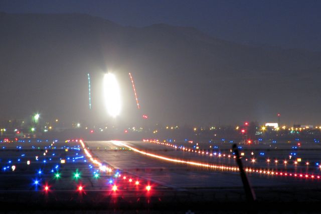 Boeing 757-200 (KRNO) - Looking down runway 34L at Reno Tahoe International at first light of a cold January morning as a UPS 757 makes its short final approach to 16R.