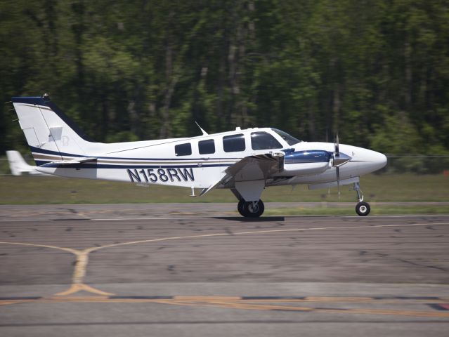 Beechcraft Baron (58) (N158RW) - Rollout after a perfect landing runway 08 at Danbury CT.