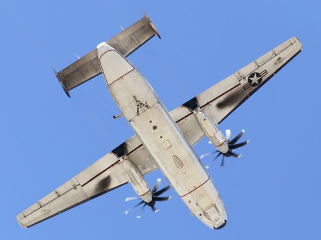 — — - A US Navy, Grumman C-2 Greyhound, departs RAAF Townsville.