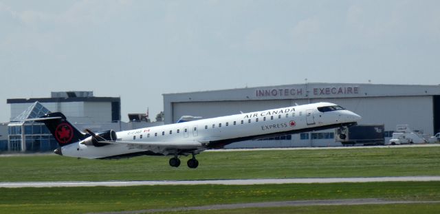 Canadair Regional Jet CRJ-900 (C-FJQZ) - Shown on departure is this 2021 Air Canada Express Mitsubishi Canadair Regional Jet 900LR in the Spring of 2024.