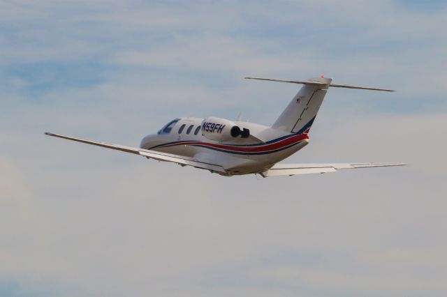 Cessna Citation CJ1 (N59FH) - N59FH is a 1995 Cessna CJ1 (525) seen here departing Atlanta's PDK executive airport. I shot this with a Canon 100-400mm IS II lens at the focal length of 371mm. Camera settings were 1/2700 shutter, F16, ISO 1600. Please check out my other aviation photography. Votes and positive comments are greatly appreciated as that helps with my photography's popularity. Inquiries about prints or licensing of this photo can be sent to Info@Flews.com