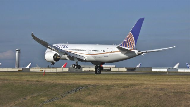 Boeing 787-8 (N20904) - BOE288 nears touchdown to runway 34L to complete its maiden flight on 8/19/12. (LN:53, c/n 34824).