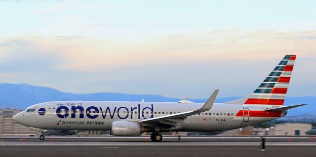 Boeing 737-800 (N919NN) - The nose wheel has just come off the runway as American's N919NN begins to rotate while making a before-sunrise departure (6:15 AM) to Dallas.