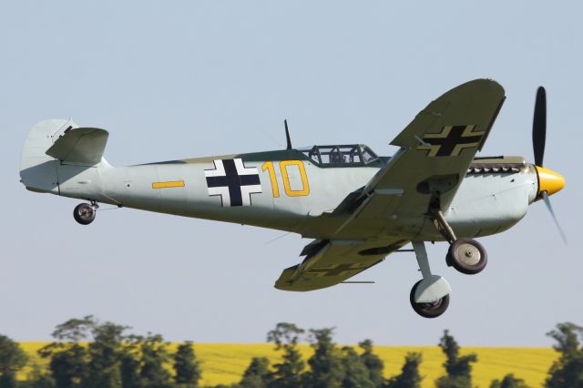 — — - Messerschmitte Me-109 approaches the grass runway at Duxford.