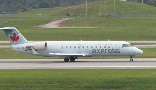 Canadair Regional Jet CRJ-200 (C-FWJI) - I was at KCVG standing at the Airport Viewing Area when I was taking the picture.