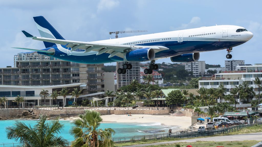 Airbus A330-300 (9H-TAJ) - Hi Fly Airbus A330-343 Malta registered 9H-TAJ over maho beach for landing.br /Aircraft flew from Porto (OPO) to Princess Juliana Int (TNCM).br /31/08/2020br /For a video of its departure please visit my youtube channel and subscribe. br /It's aviationtncm.