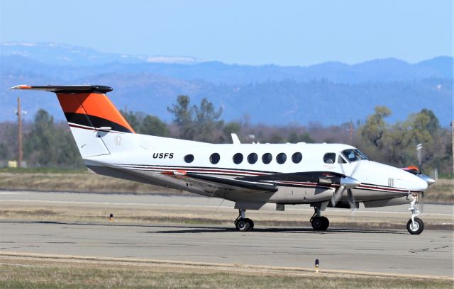 Beechcraft Super King Air 200 (N741JR) - KRDD - March 4 2020 with Beechnut King Air of the USFS base here at Redding rolling to runway 34 for departure. Orange tail color usually means Air tanker lead plane.