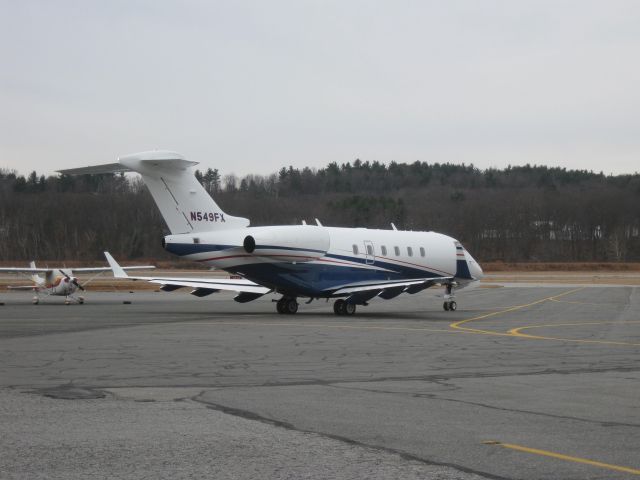 Bombardier Challenger 300 (N549FX) - Taxiing out to runway 14.