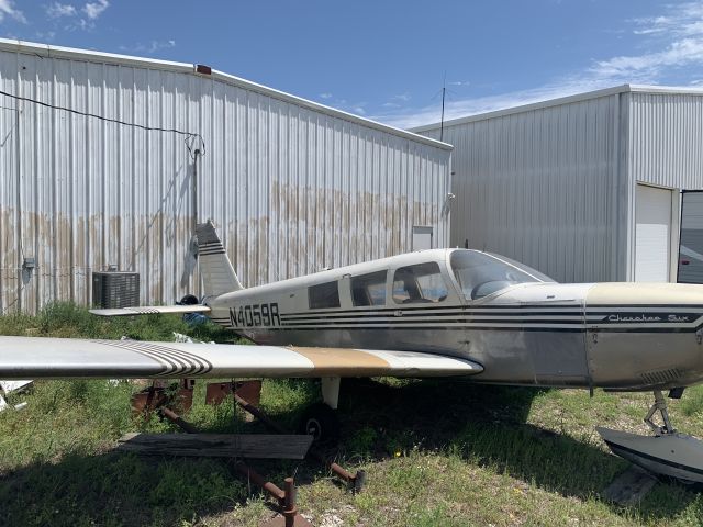 Piper Saratoga (N4059R) - Looks like it's been parked in the grass for a long time.