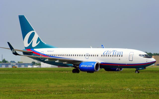 Boeing 737-700 (N315AT) - On arrival, and taxing towards the terminal.