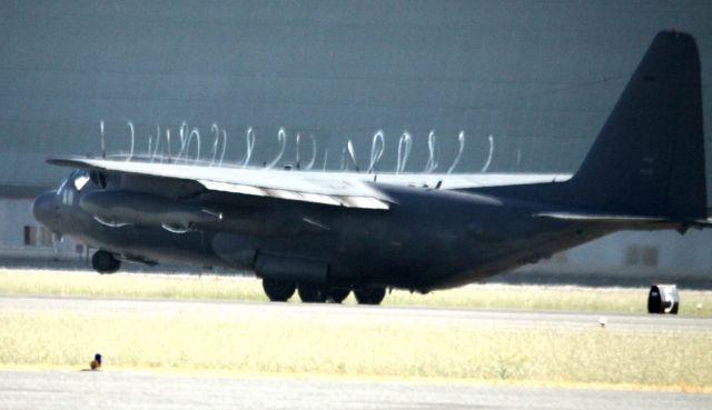 Lockheed C-130 Hercules — - 129th California Air National Guard. White wisps, are air disturbance off of the propellers, during take off 05-20-2013