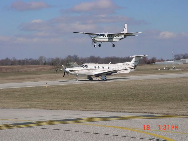 Cessna Caravan (N218PA) - Landing on same runway as a disabled aircraft (N813PA); flying in tires to be replaced from KLUK