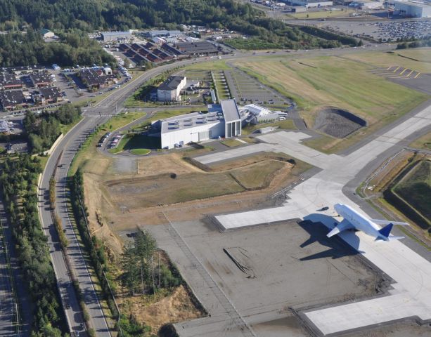 PAE — - 9-4-2010 Aerial photo of the Future of Flight Aviation Center and Boeing Tour facility in Mukilteo, Washington.  ||||  A Dreamlifter is parked on the taxiway near what will ultimately be hangars located in the back of the Flight Center (construction was completed in December 2005).  The road immediately to the LEFT of the Center is Paine Field Blvd.  At the stoplight and entrance to the Center (and the Hilton Garden Inn), the road becomes the Boeing Freeway.   The center is on the very EDGE of Paine field (not shown -- but to the right) which is located in Everett, Washington.   ||||  Great aerial photo taken by David Parker Brown 9-4-2010.  The photo appears in www.airlinereporter.com downloaded by Bruce McKinnon via a Google search