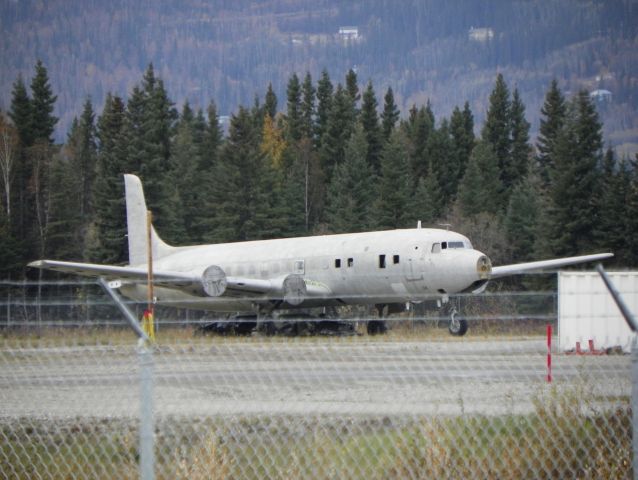 Douglas DC-6 — - DC-6 being used by the Airport Fire Dept. She will never fly again physically. But she is in another place.