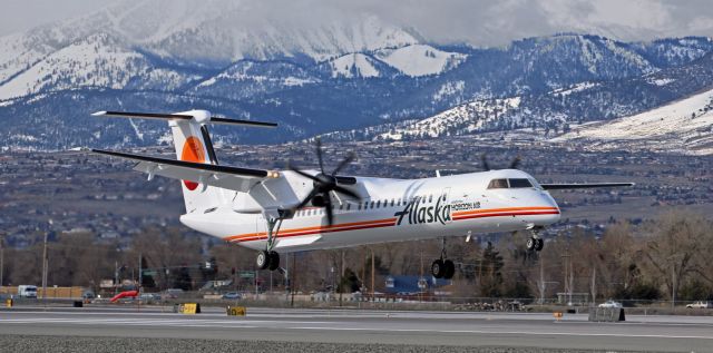 de Havilland Dash 8-400 (N421QX) - * Congrats to all Horizon personnel. Your retro livery is awesome! *br /br /Even though there were broken clouds partially obscuring the sun that was still quite low in the east, QXE's brand new, fresh from the paint barn, Horizon Air retro livery schemebird is glowing as it is about to touch down on 16R after a morning trip from Seattle.  The QXE retro schemebird had only left Victorville with its new clothes and resumed revenue service just four days prior to making its first visit to Reno (seen here) yesterday morning.  It returned for a second time, and made a RON stay, late last night.