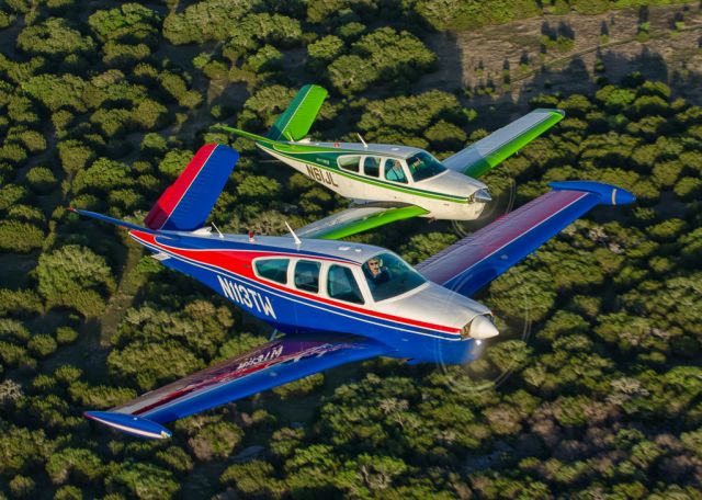 Beechcraft 35 Bonanza (N113TW) - N113TW and N61JL in tight formation...Photography by Glenn Watson of Mach Point One Aviation