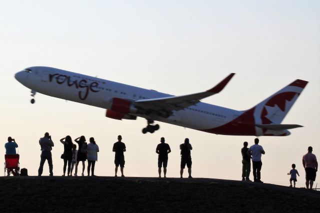 BOEING 767-300 — - People at Jacques-de-Lesseps Park watch a Air Canada Rouge 767 takeoff from 24L.