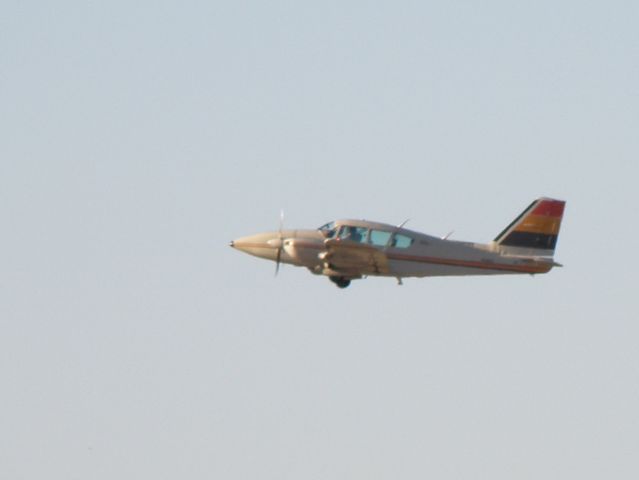 Piper Aztec (N6960A) - Piper Aztec with colorful empennage is wheels-up at Blue Grass Airport (KLEX)