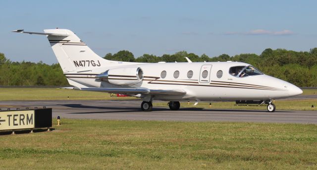 Beechcraft Beechjet (N477GJ) - A 2006 model Hawker 400XP taxiing for departure from Boswell Field, Talladega Municipal Airport, AL, following the NASCAR GEICO 500 race at Talladega Super Speedway - late afternoon, April 25, 2021. 