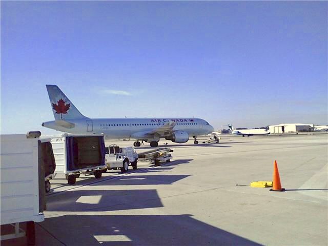 Airbus A320 — - Taken January 2010.  Note the AirTran 717 taxiing.
