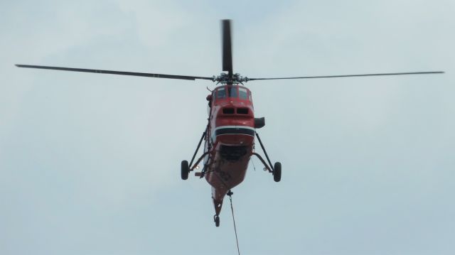 Sikorsky S-58T (N589S) - An old S58T hovering above a building near Chicago