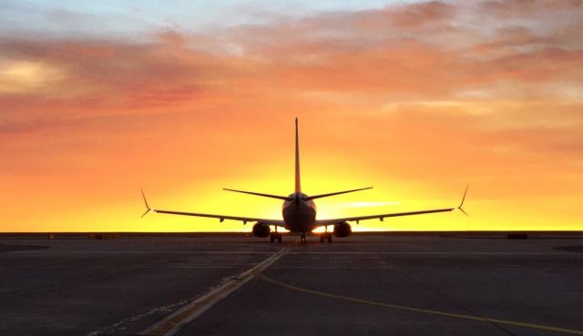 — — - Sunrise at DIA.