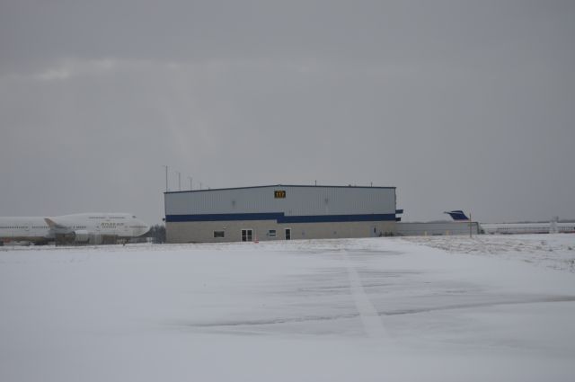 Boeing 747-400 (N322SG) - Atlas 747 and an unidentified MD80 at Atlantic Aviation.