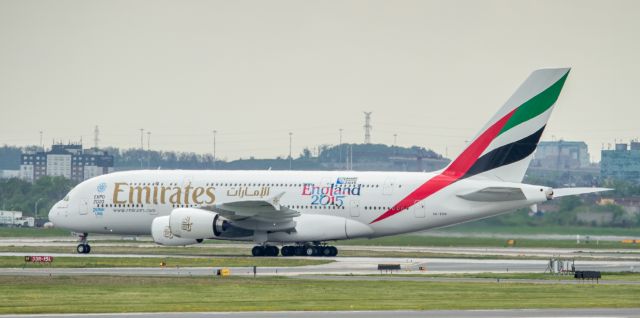 Airbus A380-800 (A6-EOH) - A6-EOH carrying the "Rugby World Cup, England 2015" stickers. Taken at great distance through some heat haze!