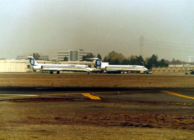 McDonnell Douglas MD-82 (N783JA) - KSJC - ex Jet America MD-82 now with Alaska Airlines taxis past the AS 727 at the old Customs Inspection station at San Jose International. The AS 727 arrived from either Guadalajara or Ensenada.