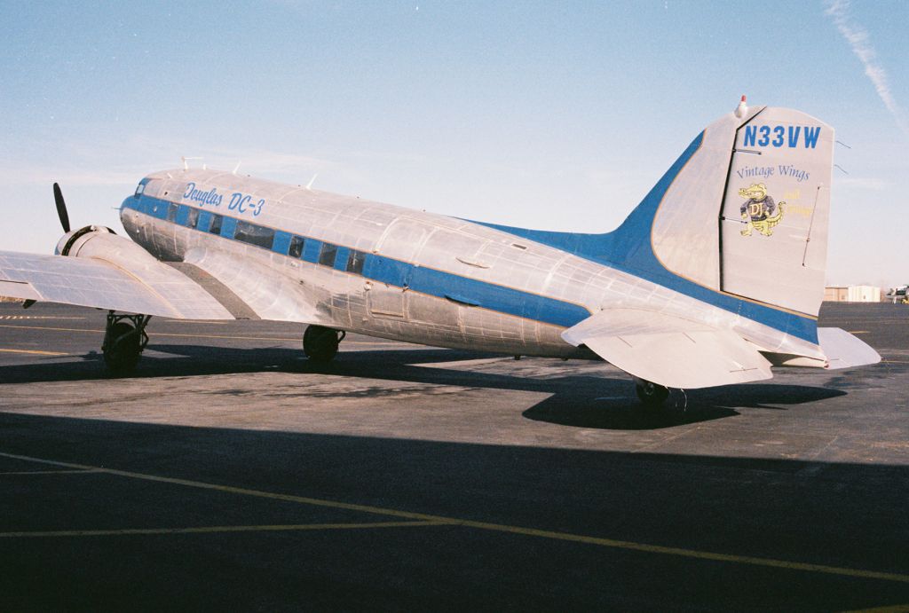 Douglas DC-3 (N33VW) - This C-47 was built as a Douglas C-47A-90-DL Skytrain, USAAF s/n 43-15935, msn 20401. It was declared surplus in 1946 according to Joe Baughers information. The aircraft went thru a succession of registrations and owners until 1998 when sold to Vintage Wings and Things of Carencro, Louisiana and registered as N33VW. It was sold to the Cavanaugh Flight Museum, Addison, Texas in 2009 and retains the FAA civil registration of N33VW. Photo was taken at KLFT, Lafayette Regional Airport, circa 2000. The aircraft has been repainted in a "WWII D-Day" livery, with "invasion stripes", since this photo.