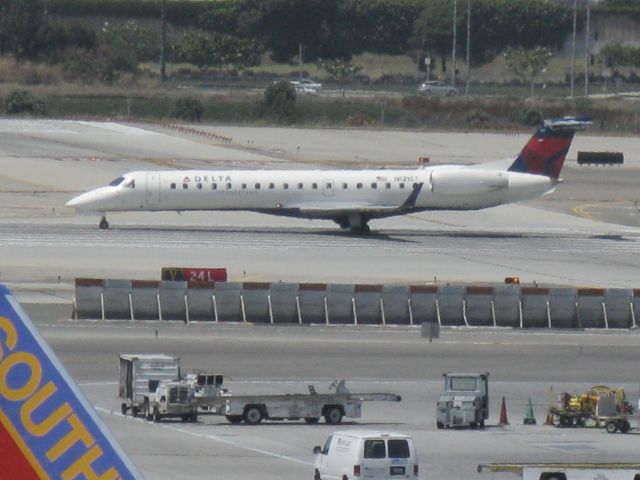 N12167 — - DL7778 ERJ-145X takesoff from 24L for PHX.