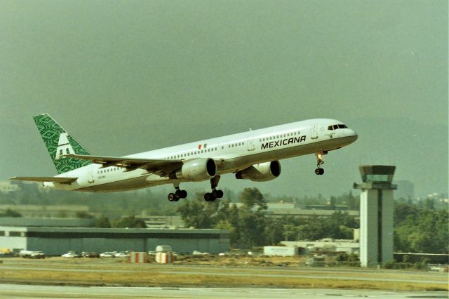 Boeing 757-200 (N764MX) - KSJC - early to mid 2000s at San Jose, Mexicana flew SJC-GDL mid 80s with 727s and moved to the A320 and then B-757. The only 757 I have ever been on was riding brake in the cockpit here at SJC moving the Mexicana 757 from remote over to Terminal C for the late PM departure. I do not remember if the 757 were serving Mexico City or Guadalajara. Shown here on the early Am flight photo taken from the top floor of the parking structure before SJC officials blocked the view with the new International Customs building. N764MX is LN 639 originally delivered to American Trans Air as N756AT in Oct 1994.