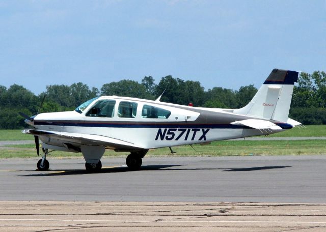 Beechcraft 35 Bonanza (N571TX) - At Downtown Shreveport.