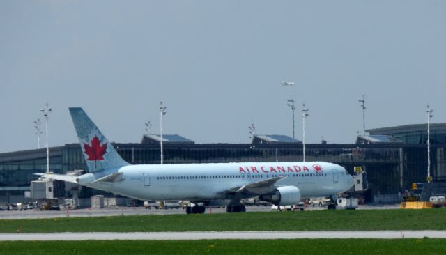 BOEING 767-300 (C-FCAG) - Shown at the Ottawa MacDonald-Cartier International Airport is a Air Canada Boeing 767-300 awaiting its next flight in the Spring of 2017.