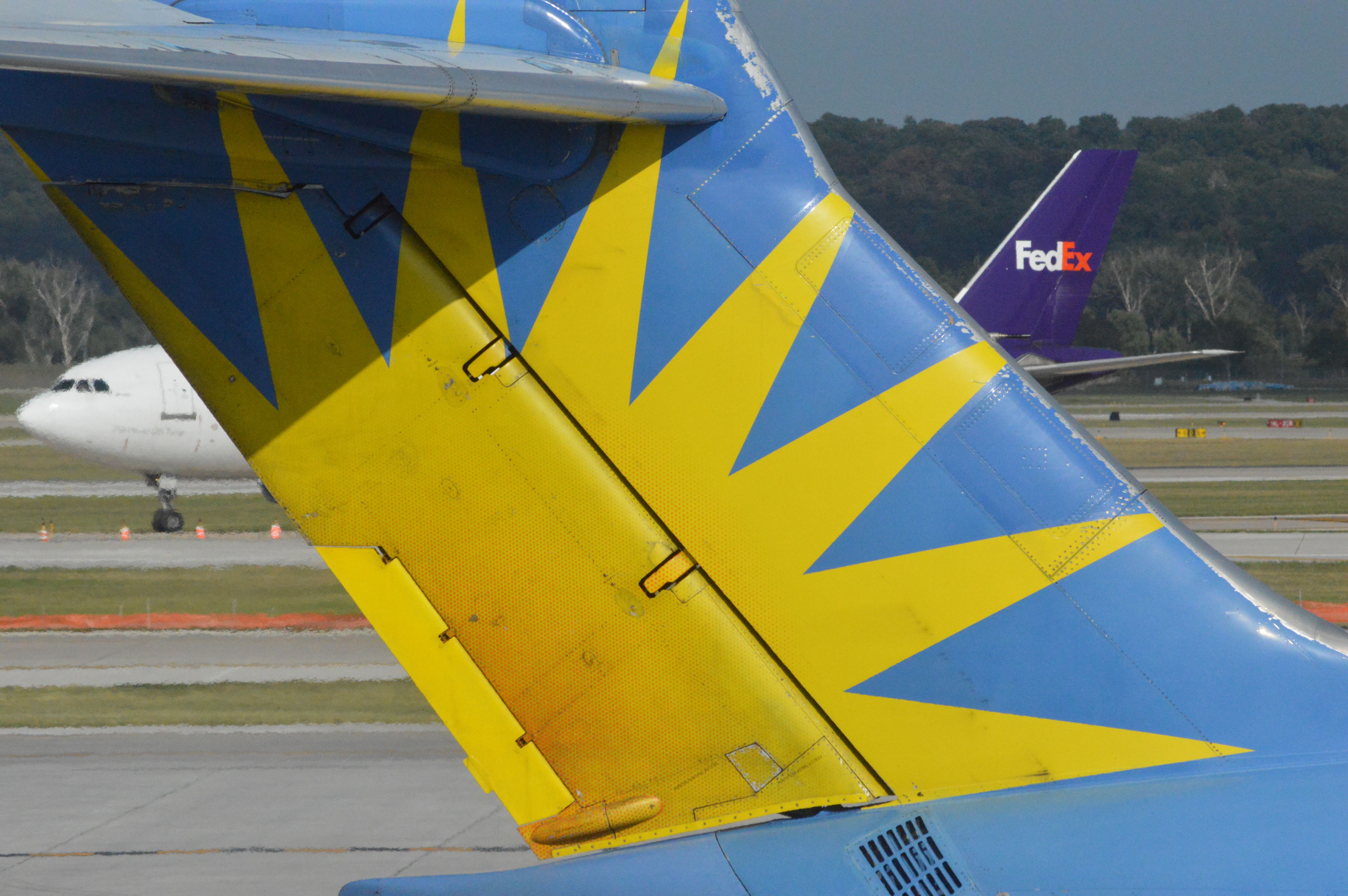 McDonnell Douglas MD-83 (N875GA) - An Alegiant MD83 waiting at Gate as FedEx 785 taxis in from Memphis at 5:17 PM CDT.  Taken August 11, 2016 with Nikon D3200 mounting 55-200mm lens. 