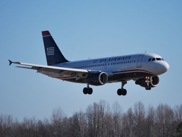 Airbus A319 (N732US) - Final for 18C - 1/31/12