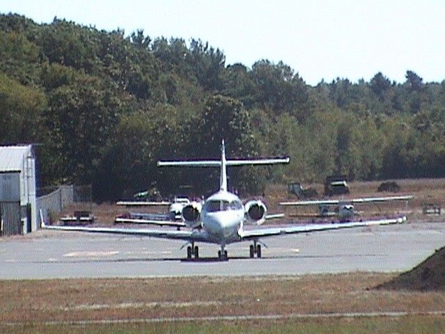 Hawker 800 (N877TM) - Sitting on the newly paved ramp at ORE.  Construction is ongoing...