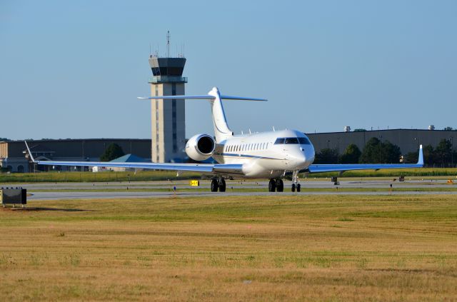 Bombardier Global Express (N302AK) - A Global 6000 taxiing to Runway 34 at Chicago Executive, taken from behind Runway 34.